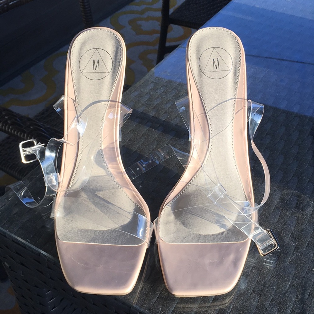 Nude and clear strap heels.